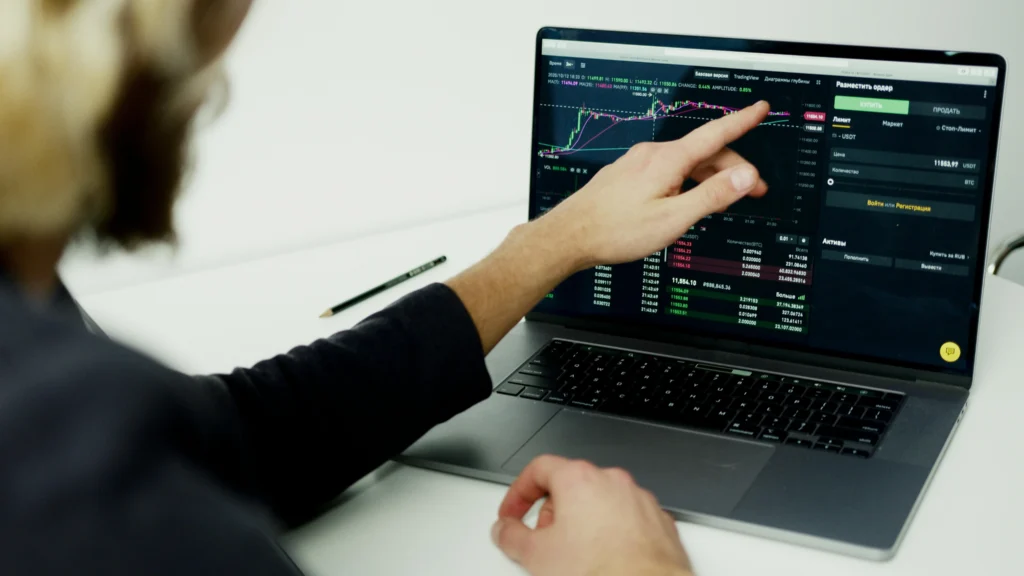 Person Using Black Laptop Analyzing Data in Computer